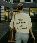 Music isn't heard it's remembered  - Women Oversized T-shirt