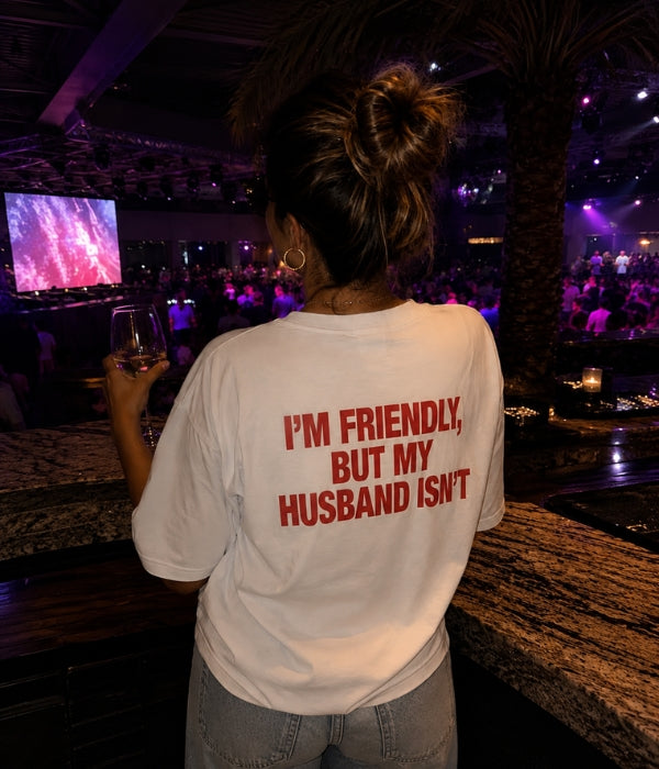 I'M FRIENDLY BUT MY HUSBAND ISN'T - Women Oversized T-shirt