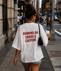 RUNNING ON CHAOS AND CAFFEINE - Women Oversized T-shirt